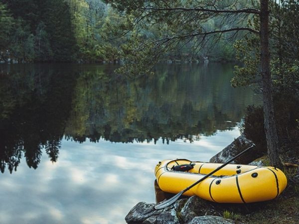 yellow one person packraft boat